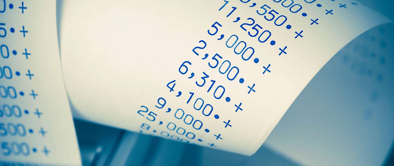 Image of payroll, adding machine paper roll with numbers