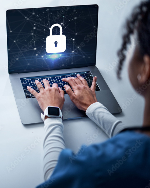 Woman on laptop that shows a cybersecurity graphic