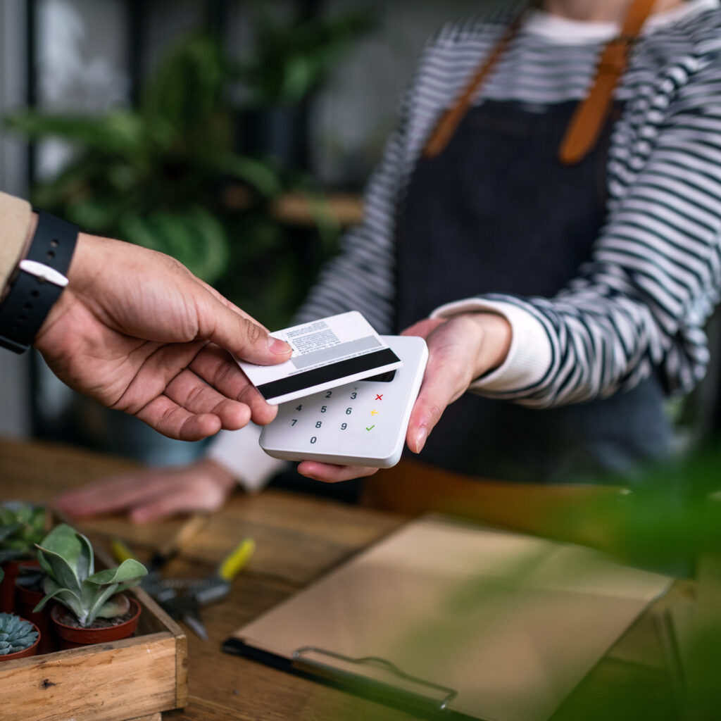 Customer paying with a bank card in a shop