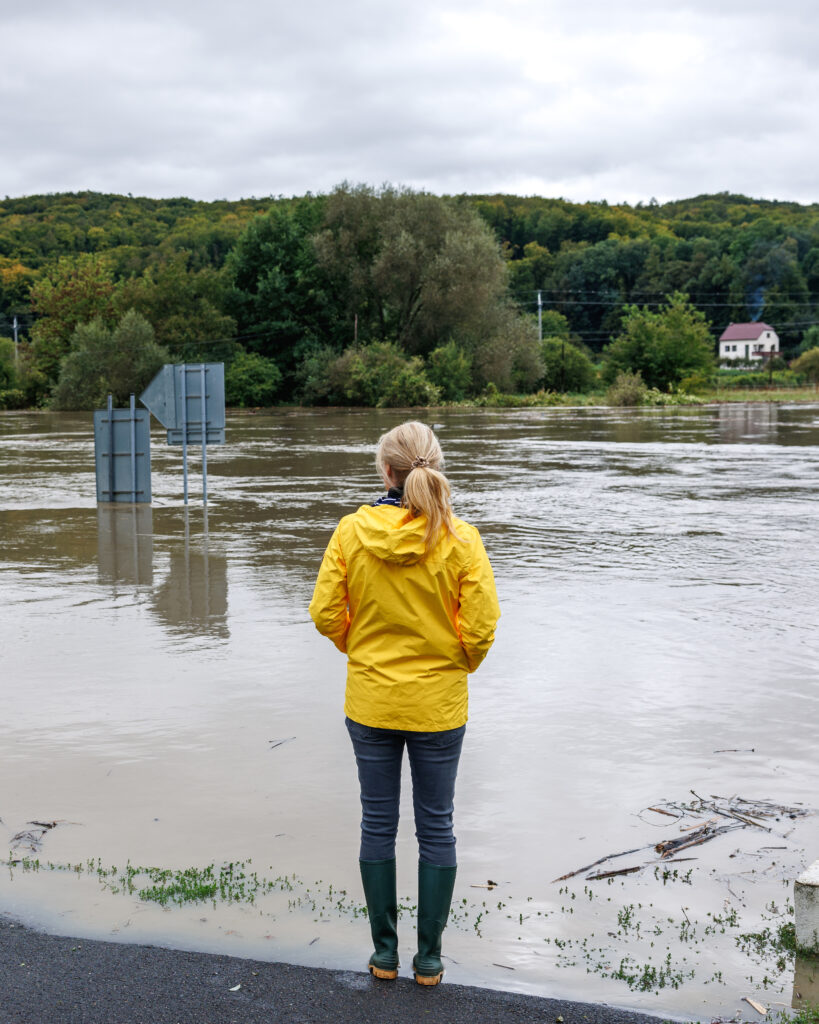 Woman looking at flood damage