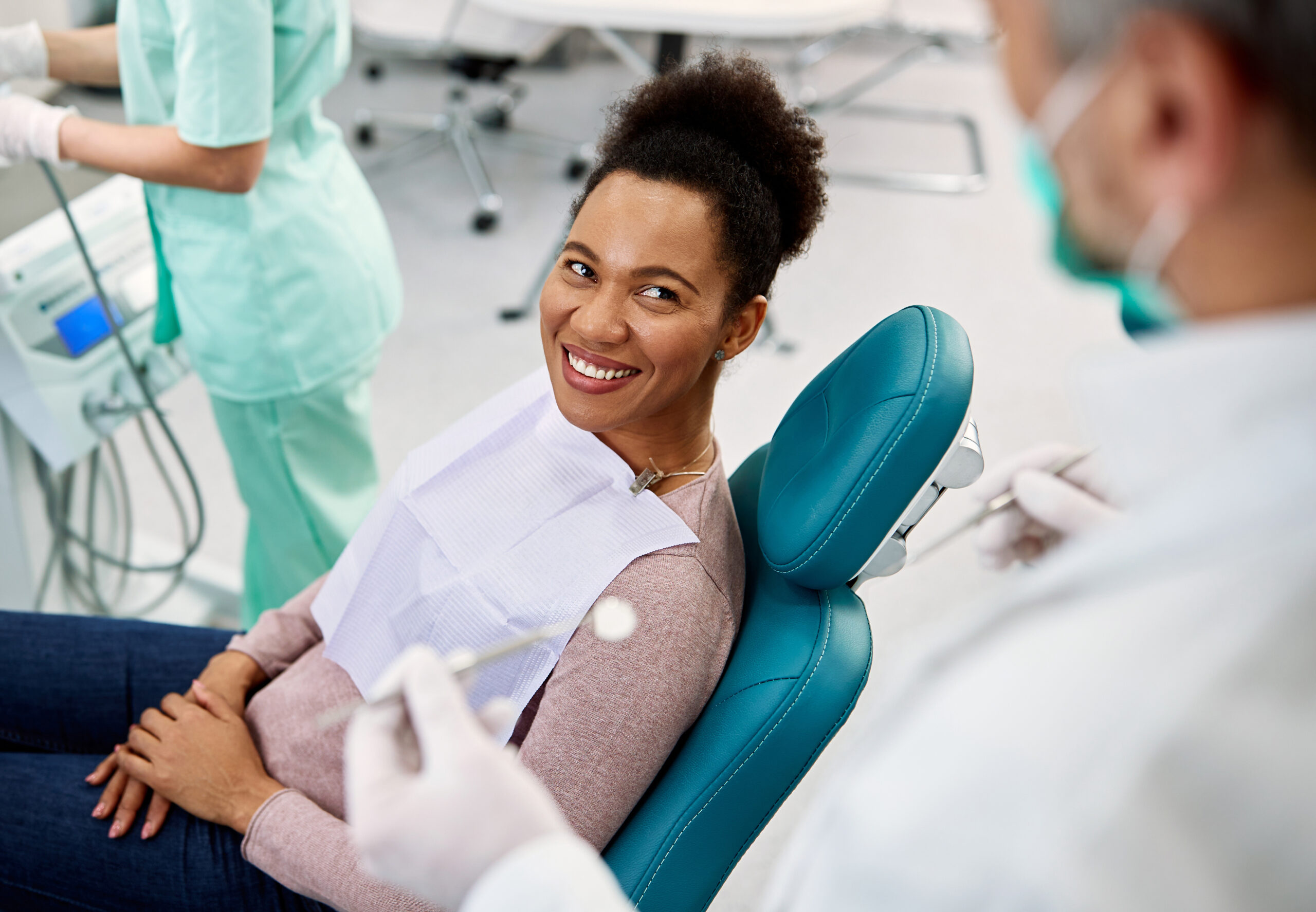 Woman smiling at a dentist appointment